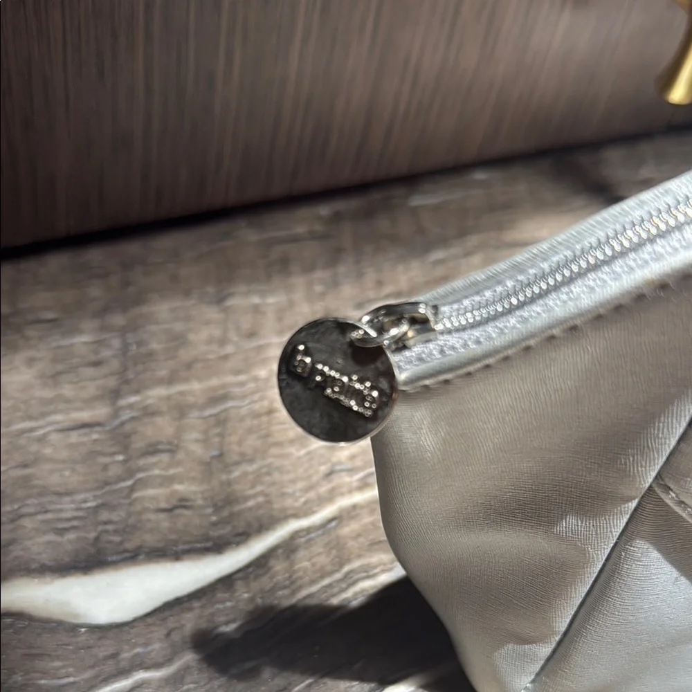 La Prairie Silver Cosmetic Bag with Geometric Design